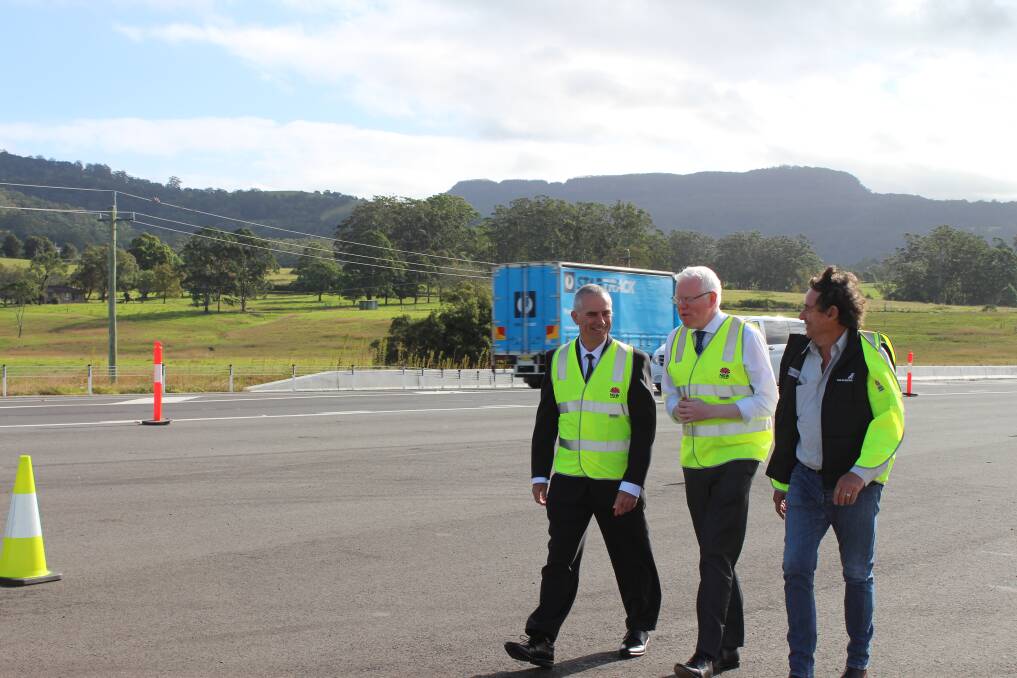  
Kiama MP Gareth Ward with senior project manager from RMS,  Ian Archer and local transport operator Tony Emery at the announcement of the successful contractors, Downer and Seymour Whyte, for the $450 million upgrade of the Princes Highway between Berry and Bomaderry.
