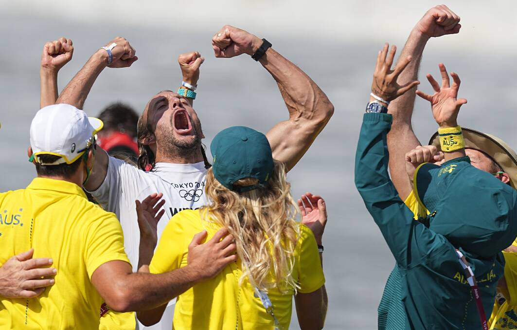 GOT TO LOVE THE PASSION: Culburra Beach's Owen Wright celebrates his bronze medal with his Australian Irukandji teammates. Photo: EPA