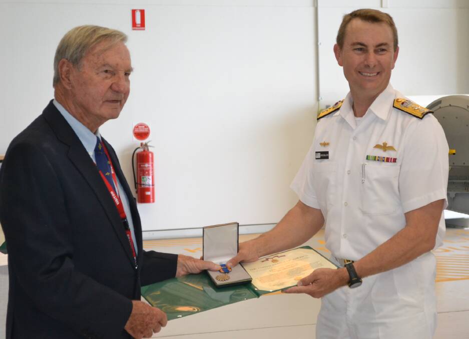 
Rear Admiral (retired)  Neil Ralph accepts the United States Air Medal from the Commander Fleet Air Arm, Commodore Chris Smallhorn in 2016.