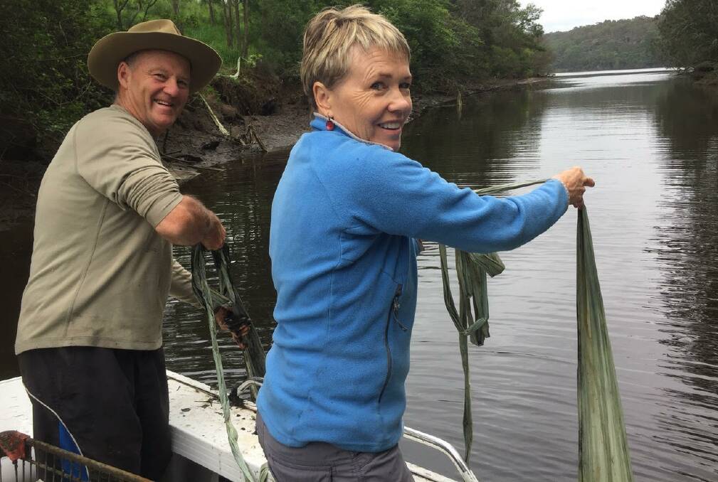 Peter Hanson and Margie Jirgens collecting plastic silage wrap from Nowra Creek.
