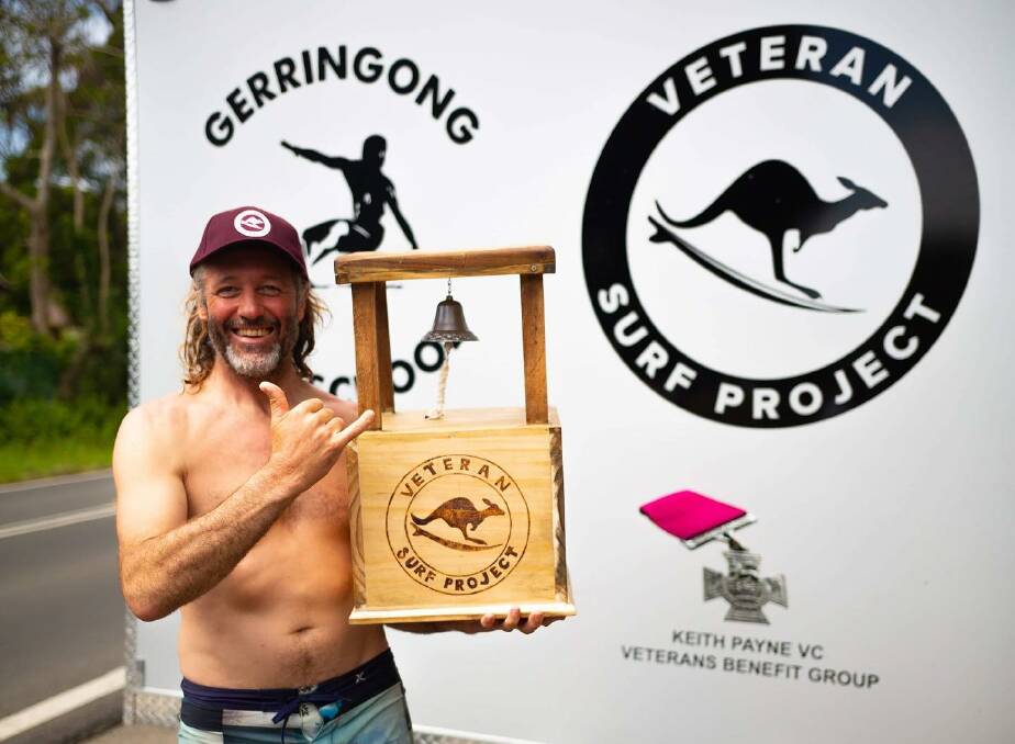 MILESTONE: To celebrate the success of the Veteran Surf Project and to mark the 50th surf session of participants Greg Symmans and Greg Williams, project coordintaor Rusty Moran was presented with a VSP replica Bells trophy, complete with engraving of all the participants so far.
