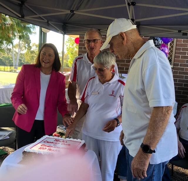 CELEBRATION: Gilmore MP Fiona Phillips and life members Doug Corish, Margaret Sawers and John Deeves cut the Nowra Croquet Clubs 100th birthday cake.Image: Supplied
