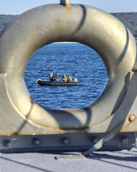 
TEST: HMAS Gascoyne ship's divers conducting mine disposal as part of unit readiness evaluation.