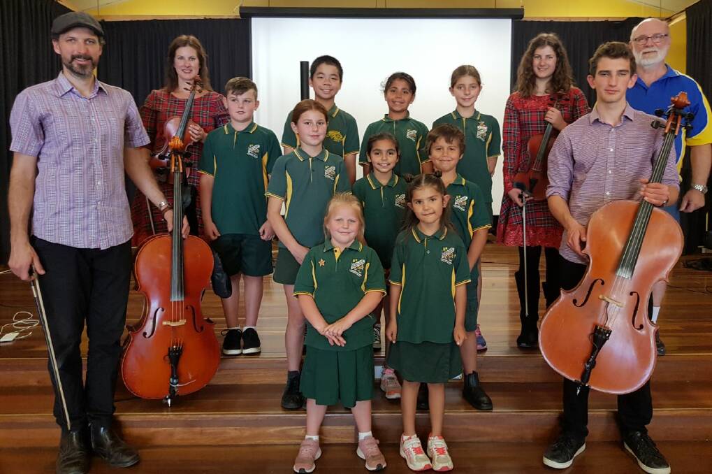 The incredibly talented String Family, parents Sarah and Joel with their children Heath and Ashleigh during a visit to Nowra East Public School with Bomaderry Lions member Bob Mortyn and students (back from left) Lachlan Fairweather, Kelvin Li, Jeneven Williams-Scott, Alisha Hybinett (middle) Kia Pender, Miarra Davison, Jett Forwood, (front) Pixi Lonesborough and Lylah Thomas-Scott.
