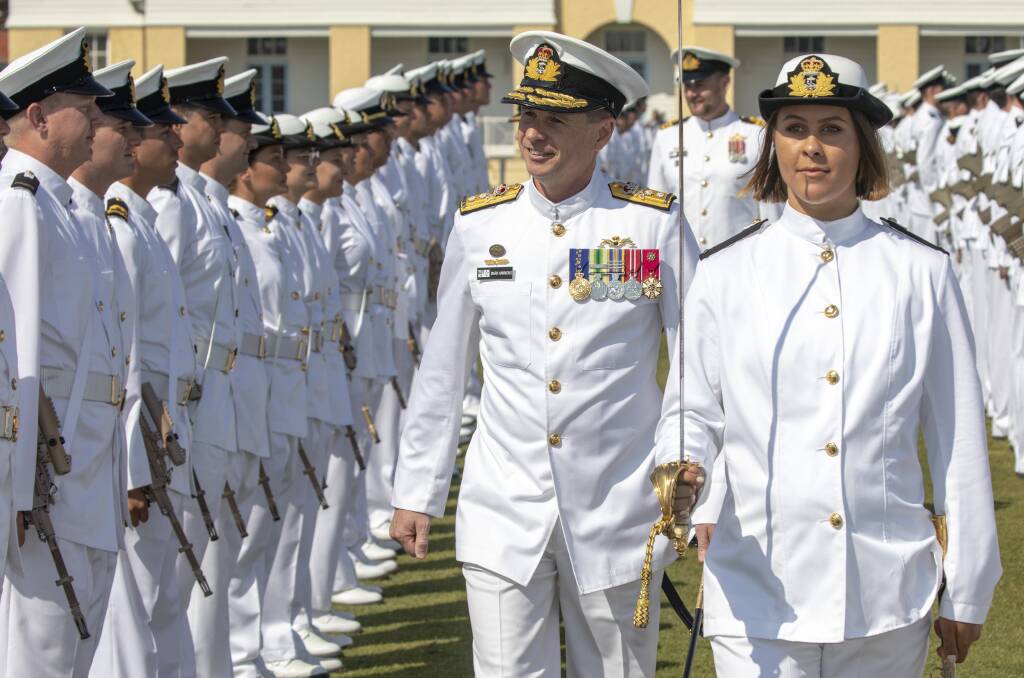 Reviewing officer of the new entry officers course graduation parade, Deputy Chief of Navy, Rear Admiral Mark Hammond inspects the guard at HMAS Creswell. Photo: Cameron Martin
