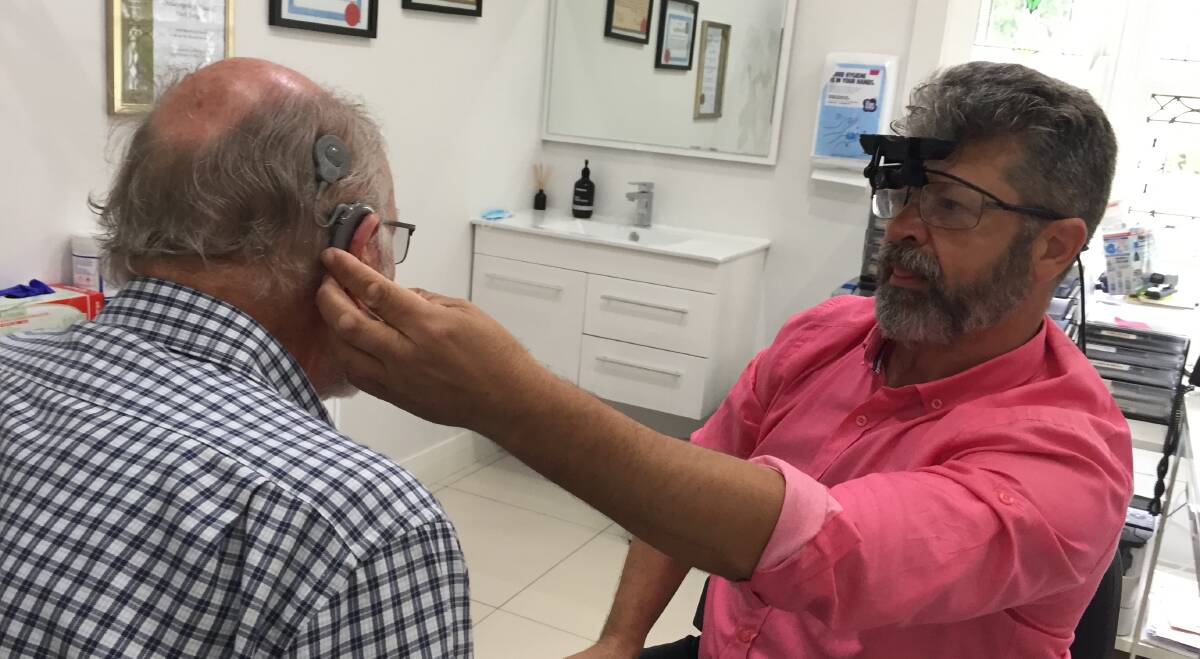AMAZING: Nowra man Ian "Tiny" Warren can control his cochlear implant from an app on his mobile phone.