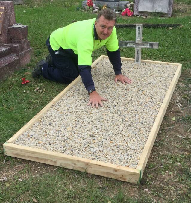 Nowra RSL Sub-Branch secretary Rick Meehan with Private Raymond Benson’s restored grave in the Nowra General Cemetery.