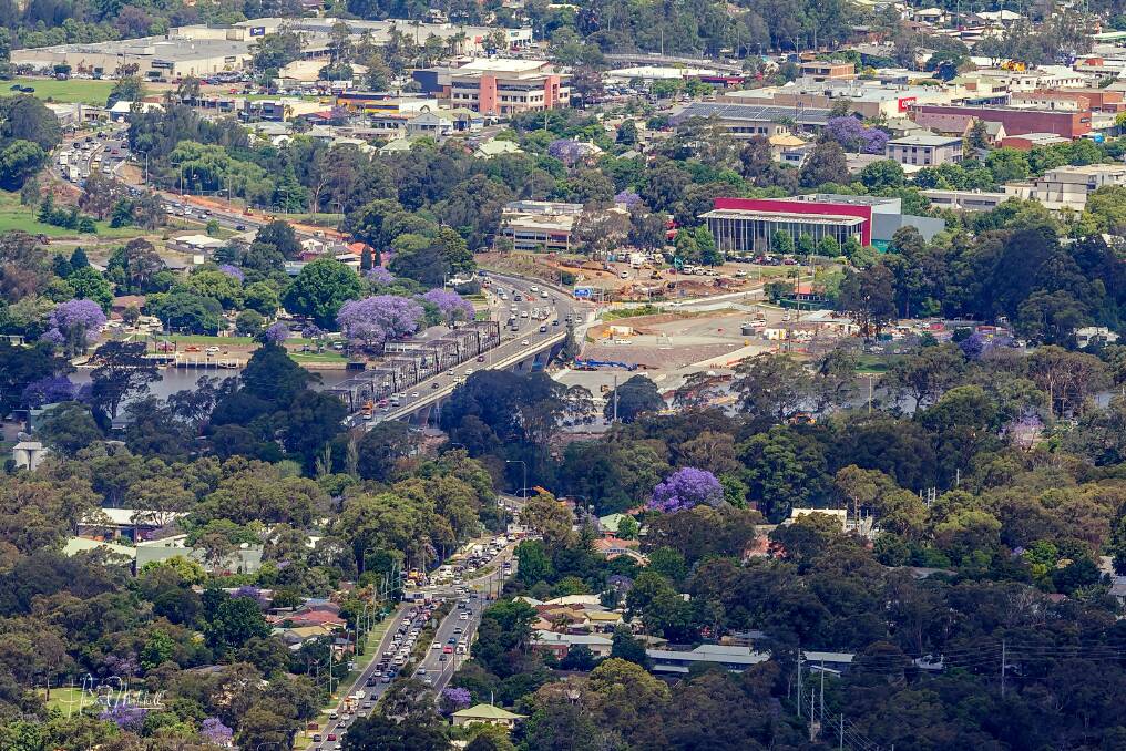 CLEAR VIEW: Howard Mitchell's amazing photograph of work on the new Nowra bridge crossing from Cambewarra Mountain Lookout.
