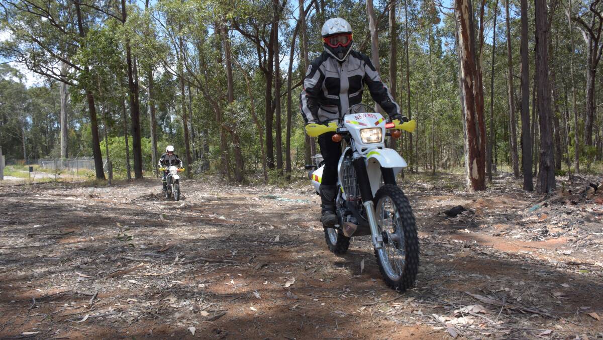 Two members of the Shoalhaven RFS trail bike team Martin Copes and Mark Bourke. 