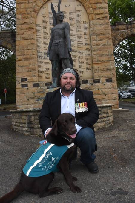 Iraq, Afghanistan veteran Trevor Lynch with his service dog Mocha.