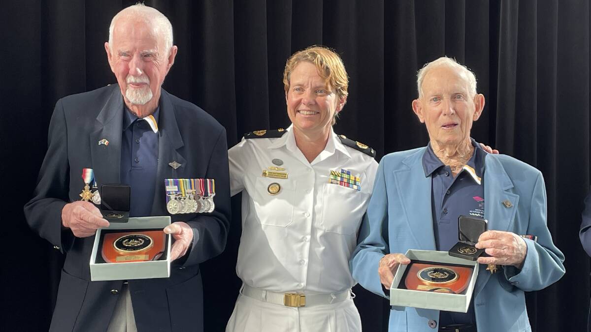 CONGRATS: Warrant Officer of the Navy Deb Butterworth congratulates Bob Brown (left) and Rusty Marquis on their milestone.