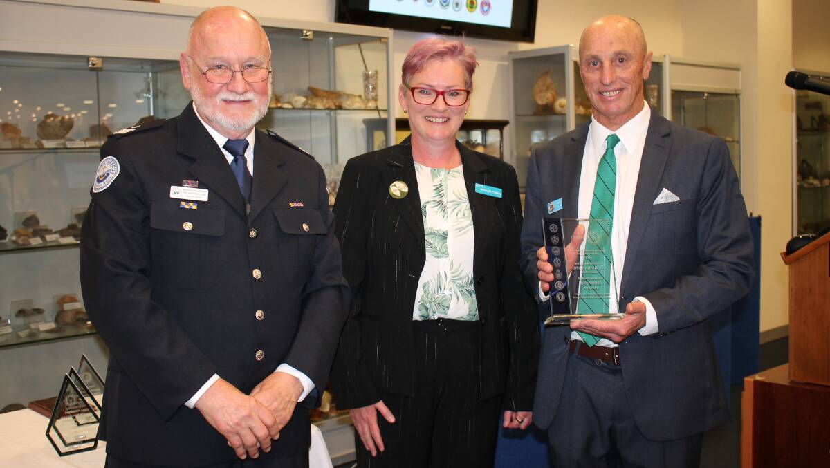 CONGRATS: Shoalhaven Emergency Services Community Awards Ambassador Dr Peter Taylor and Shoalhaven Mayor Amanda Findley present Shoalhaven NSW Police Officer (sworn category) of the Year to Senior Constable Kyle Wilson.