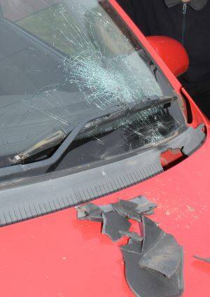 SMASHED: Both vehicles suffered smashed windscreens and damage to their bonnets during the explosion.