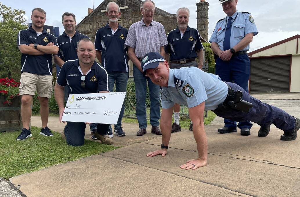 WELL DONE: Freemasons Lodge Nowra Unity members (back row from left) Jake Marsh, Duncan Brown, Peter Cumes, Robert Cochrane, Worshipful Master Mark Baker and David Baker (front) with Kangaroo Valley cop, Senior Constable Todd Cremer and Officer in Charge of the Nowra Police Station, Inspector Ray Stynes.