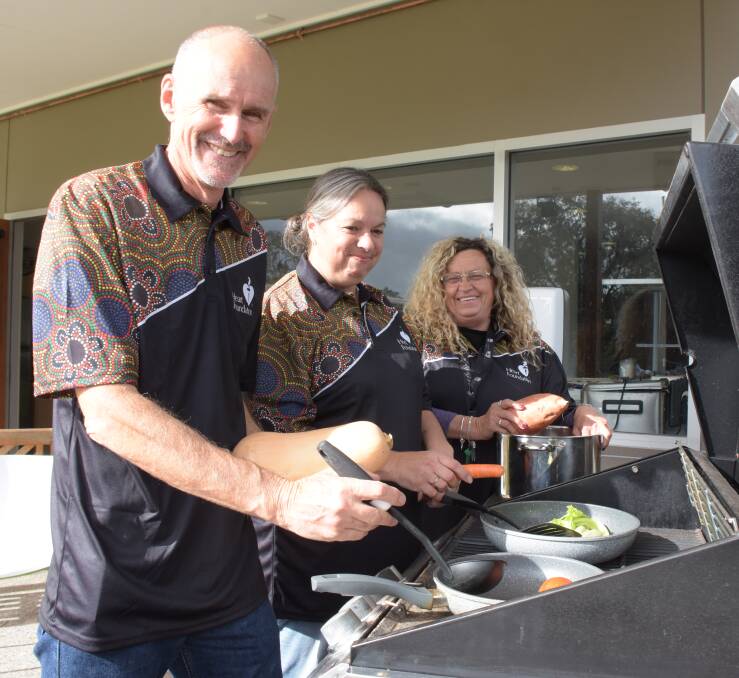 Wellways community supervisor Kathy Musico, Cullunghutti community engagement officer Tina Seymour and National Heart Foundation regional health promotion coordinator Andy Mark prepare for this week's annual Koori Cook Off.