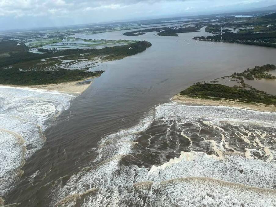 SPECTACULAR: Water rushes from the Shoalhaven River opening at Shoalhaven Heads into the ocean. Photo: Max Cochrane