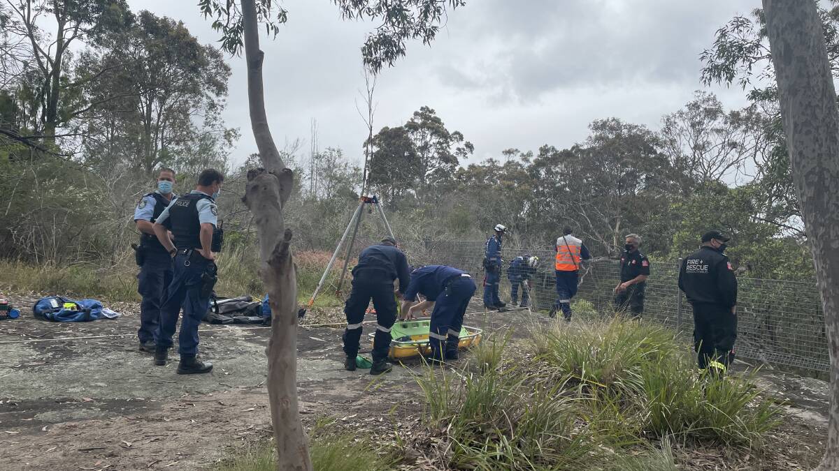OPERATION: Emergency services at Yurunga Drive North Nowra, where a woman has fallen 10 metres over a cliff. Photo: Grace Crivellaro