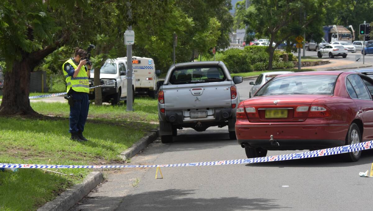 Forensic police have photographed the scene in Bridge Road, Nowra where a man was allegedly attacked with a tyre iron.
