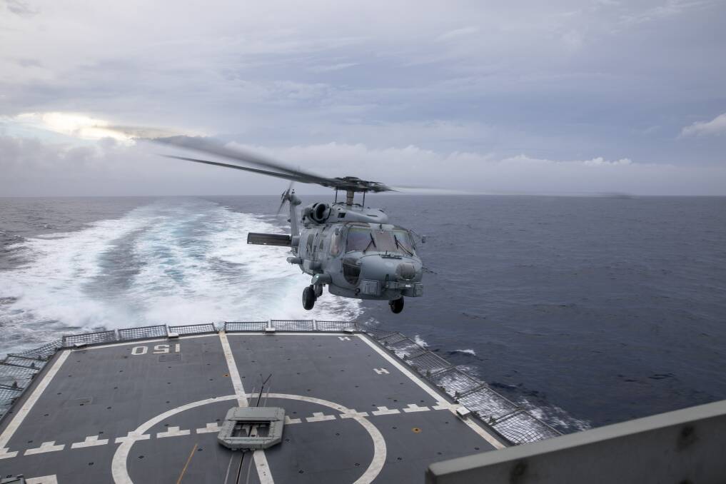 MISSION: HMAS Anzac launches her embarked MH-60R helicopter to medically evacuate an Indonesian fishermen rescued in the Indian Ocean. Photo: Thomas Sawtell