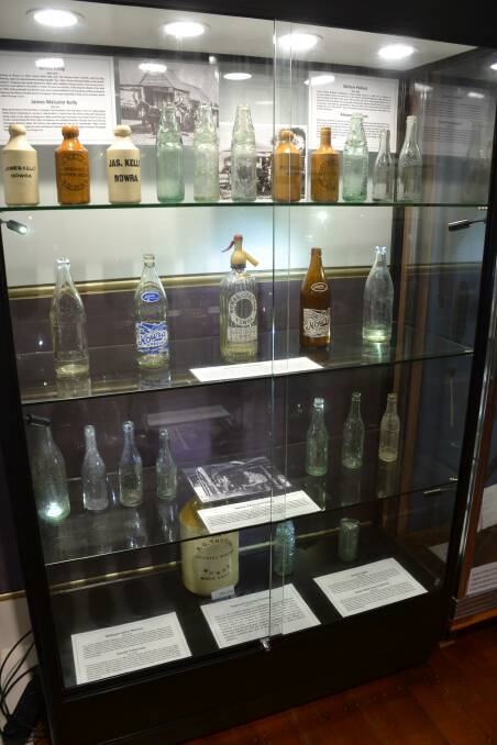 ON SHOW: A disoplay of local cordial bottles ion show at the Nowra Museum.
