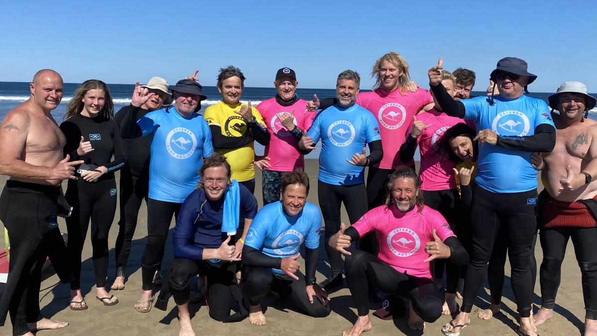GREAT TIME: Veteran Surf Project co-ordinatoor Rusty Moran (pink shirt front row) with another happy group of veteran surfers after a session on Gerroa's Seven Mile Beach.