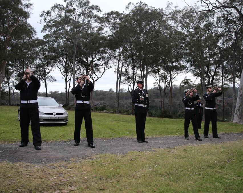 FIRE: Honour guard from HMAS Albatross perform a firing gun salute during the commemorative service.