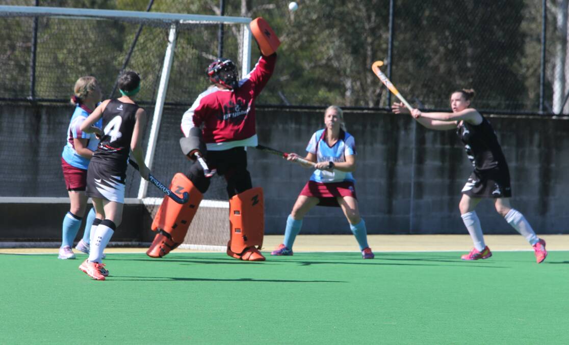 Shoalhaven Heads Mermaids' keeper Anne Boatswain makes a great save in Saturday's final. Photo: Robert Crawford