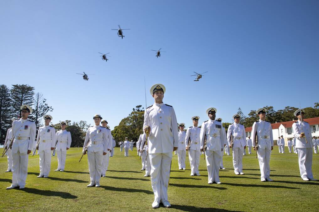 FLYOVER: A formation of Royal Australian Navy helicopters conducts a flyover of the parade ground at HMAS Creswell during the New Entry Officers Course 63 graduation ceremony. Photo: Cameron Martin
