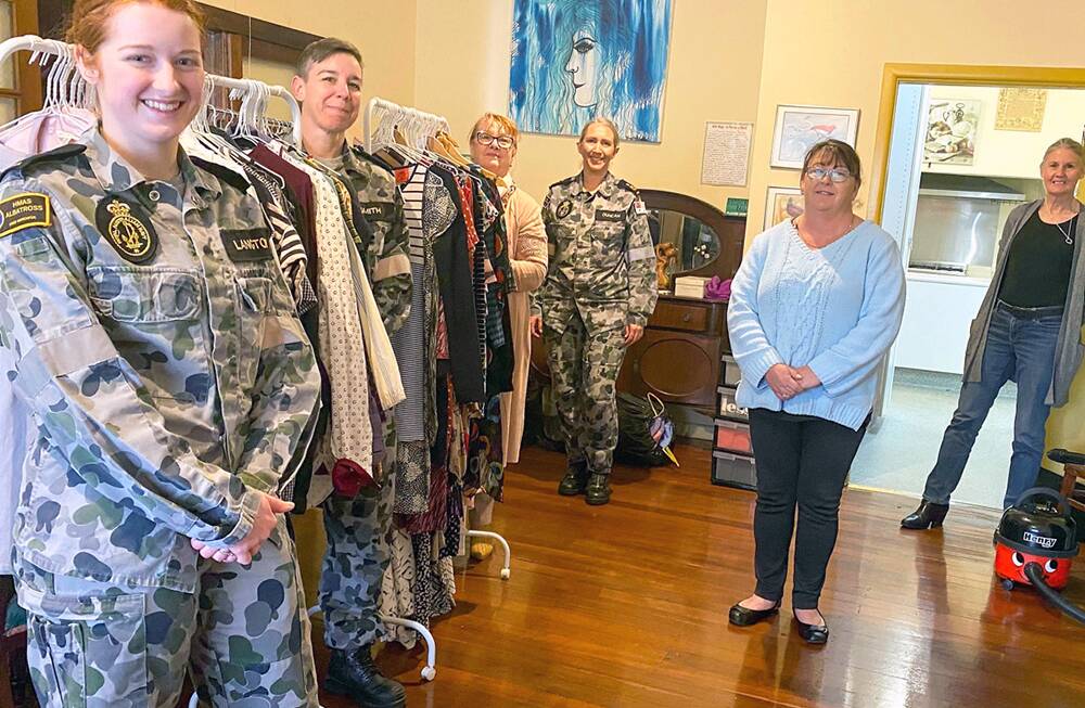 SUPPORT: Able Seaman Sophie Langton, Petty Officer Casey Smith, Petty Officer Cassandra Duncan; and Chief Petty Officer Linda Eddington, together with Supported Accommodation & Homelessness Services Shoalhaven Illawarra (SAHSSI) volunteers, setting up at the SAHSSI donation drop off point.
