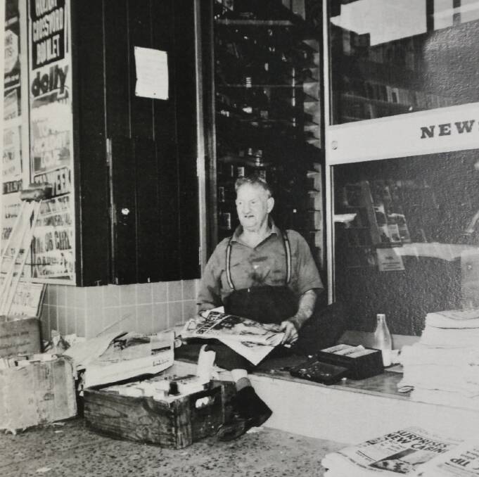 Well-known Nowra identity Oswald Frederick “Bluey” Honeysett, selling papers outside Sturgiss Newsagency.  Photo: South Coast Register.