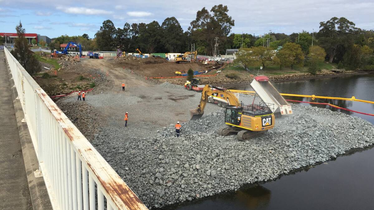 MASSIVE: A temporary rock platform being built in the Shoalhaven River as part of work on the new $342 million Nowra Bridge will contain around 22,000 tonnes of materials. Some locals have affectionately named the structure, which will be used in bridge piling and foundation work, Fulton Hogan Island.
