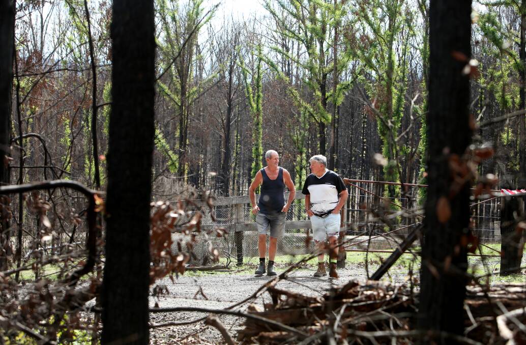HAPPY TO HELP: Well-known Shoalhaven locals and proud ex-pat Kiwis Doug Bice and Phil Olsen are keen to do their bit at the Kangaroo Valley BlazeAid camp. Photo: Sylvia Liber
