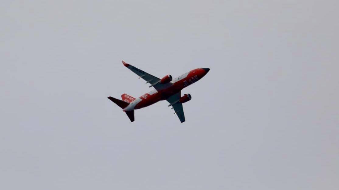 A fixed-winged water bomber in action over the Booderee fire. Photo: Maree Clout
