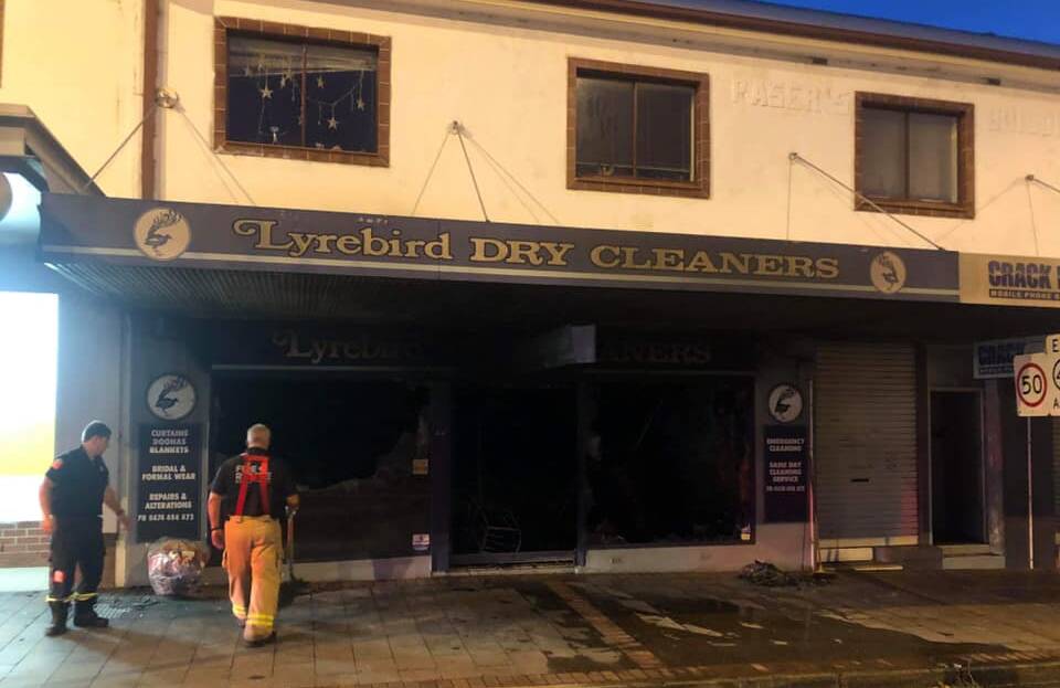 DAMAGE: Fire and Rescue NSW personnel inspect the damage to Lyrebird Dry Cleaners in the Nowra CBD early Thusrday morning. Photo: Fire and Resce NSW Berry