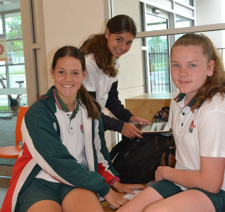 GO: Georgie Godsell, Aysha Sanchez and Charlotte Hay prepare for competition.