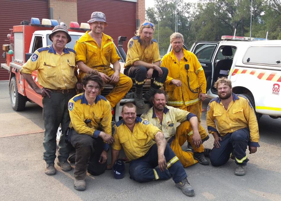 HARD WORK: Ron McKinnon (far left) with his fellow members of the Rural Fire Service's specialised fireline tree fallers group. Photo: Supplied 