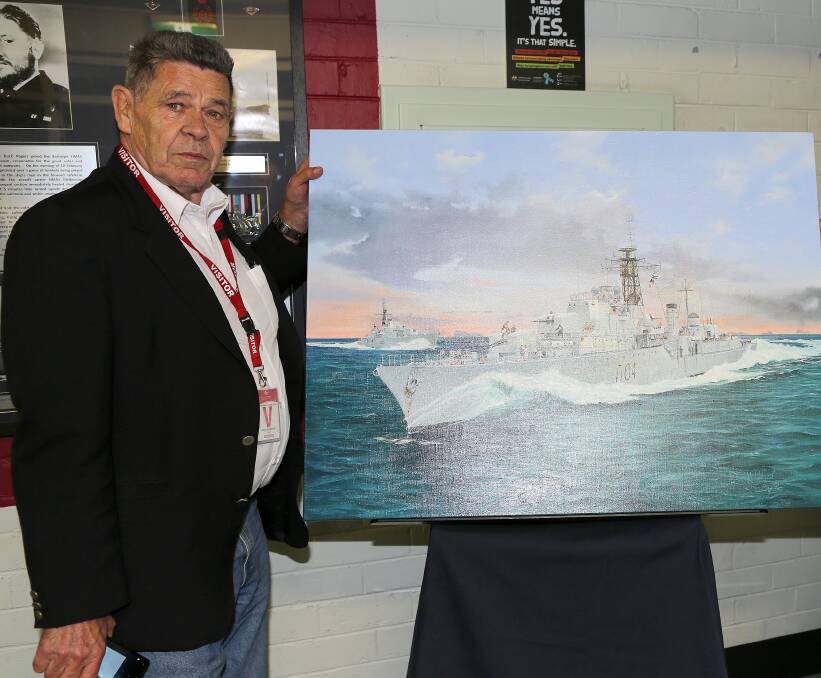 Voyager Survivors Association's Alex Hagerty with a painting of of HMAS Voyager presented to the to Recruit School by the HMAS Voyager Survivors Association, Naval Association (Victoria) and HMAS Sydney Association. The painting was commissioned by the associations, painted by Randall Wilson and will hang in Rogers Division, Recruit School. Rogers Division is named for CPO Jonathon Rogers, GC DSC. Photo: Vickie Austin
