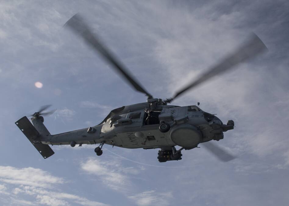 BACK IN THE AIR: The RAN has lifted flying suspensions on its MH-60R Romeo Seahawk helicopters Photo: Bradley Darvill