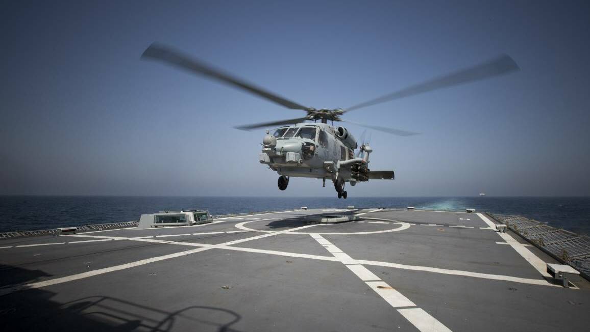 RECORD HAUL: HMAS Warramunga’s deployed MH-60R Seahawk Romeo helicopter, Nemesis, from 816 Squadron at HMAS Albatross has a played a major role in its many drug busts in the Middle East. Photo: Tim Gibson