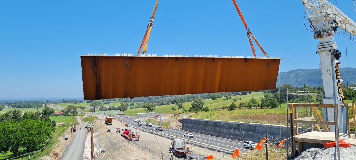 UP, UP and Away: A final girder piece put in place on the Strongs Road overpass. Image: Transport for NSW