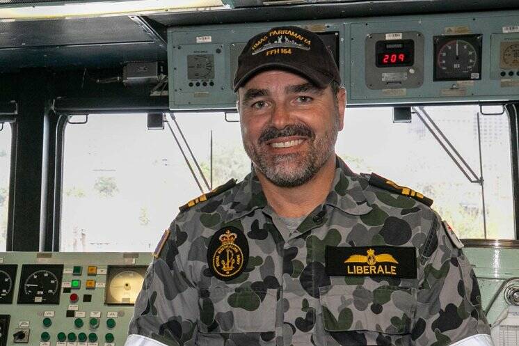MILESTONE: Flight Commander Lieutenant Commander Damien Liberale onboard HMAS Parramatta alongside Fleet Base East. Photo: Photo: Leo Baumgartner