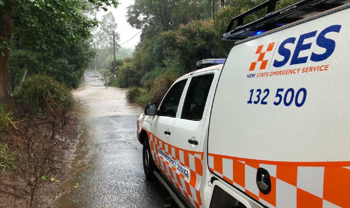 INSPECTION: SES crews inspecting the flooded causeway on Hockeys Lane at Cambewarra.Photo: SES Nowra