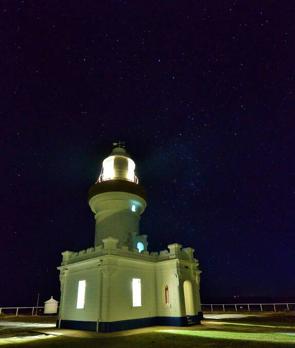 The stunning Point Perpendicular Lighthouse lit at night. Photo: Dannie and Matt Connolly Photography