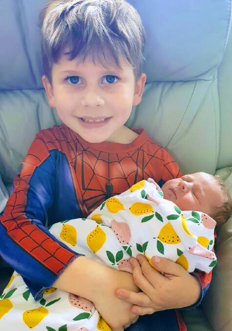 PROUD BIG BROTHER: Jack Behrmann proudly shows off his new sister, Adeline Violet who was born at the Shoalhaven District Hospital on October 27.