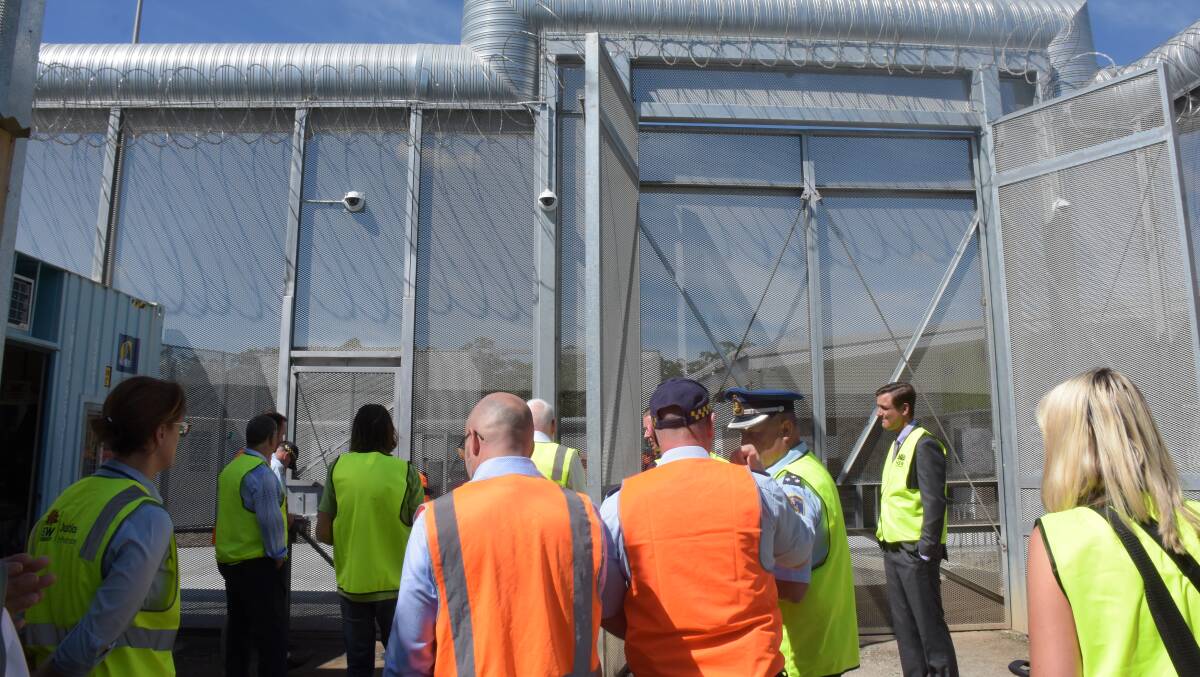 The media, Kiama MP Gareth Ward and John Ajaka MLC and centre personnel prepare to enter the new maximum-security facility at the South Nowra Jail.
