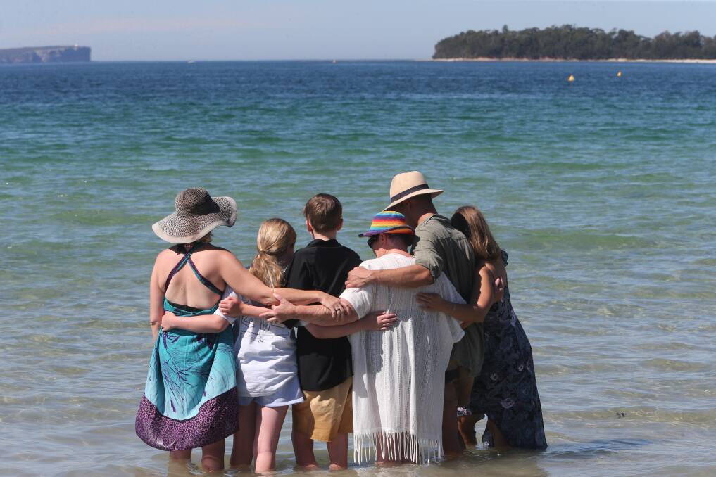 GOODBYE: Family members farewell Sally Holland at her beloved Collingwood Beach in Jervis Bay.