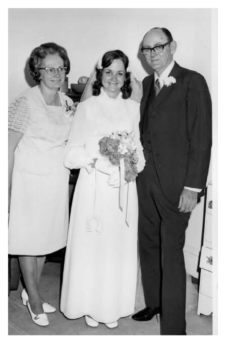 Kathy with her parents Molly and Jim on her wedding day.