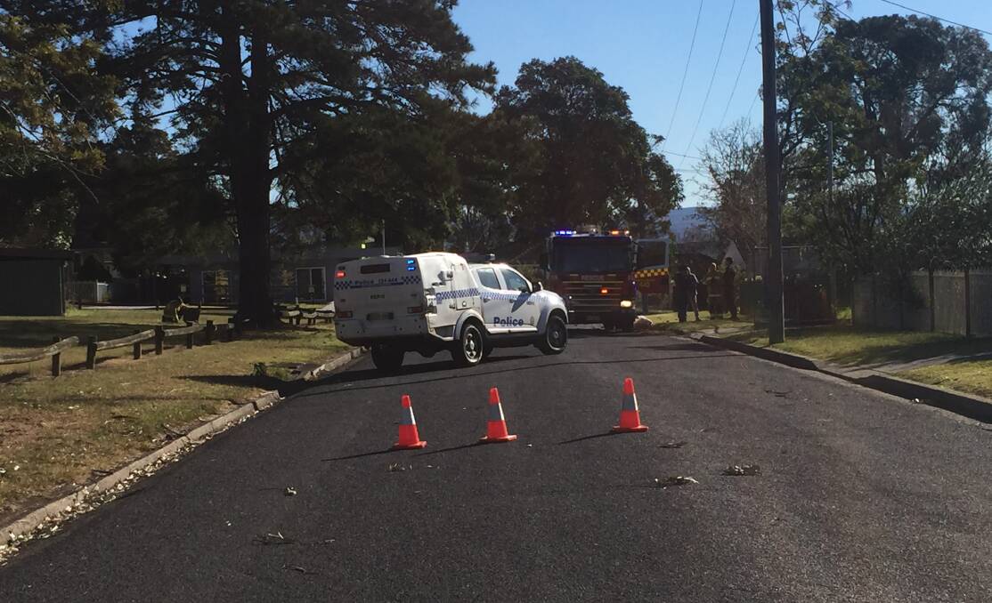 NSW Fire and Rescue and NSW Police crews remain on the scene of the house fire in Hobart Street. Photo: Zoe Cartwright