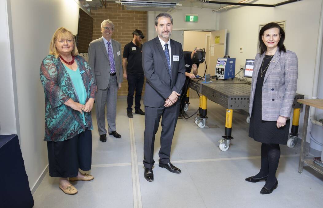 EXCITING: Shoalhaven City Council Assistant Deputy Mayor Patricia White, UOW Vice-Chancellor Professor Paul Wellings, UOW Director of the Facility for Intelligent Fabrication Dr Paul Di Pietro and Senator Concetta Fierravanti-Wells touring the Nowra Agri-business Innovation Hub. Photo: Mark Newsham