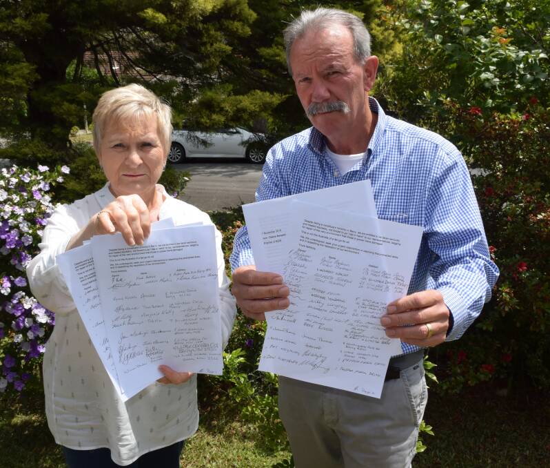  FIGHT: Berry residents Tina Ballard and Nic Delfos with the letter to be sent to Premier Gladys Berejiklian signed by 64 residents affected by the noise from the bypass. Photo: Hayley Warden